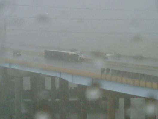 Truck overturned due to winds on I-95, moments after burst passed.