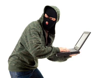 Man stealing data from a laptop iStock_000013972877XSmall.jpg