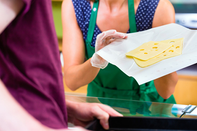 http://www.dreamstime.com/stock-image-saleswoman-counter-offering-cheese-organic-supermarket-customer-image46778591