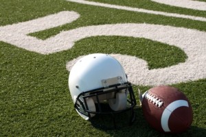Football helmet on gridiron