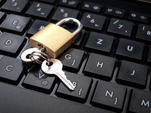 Keys and padlock on the computer keyboard as a data security concept.