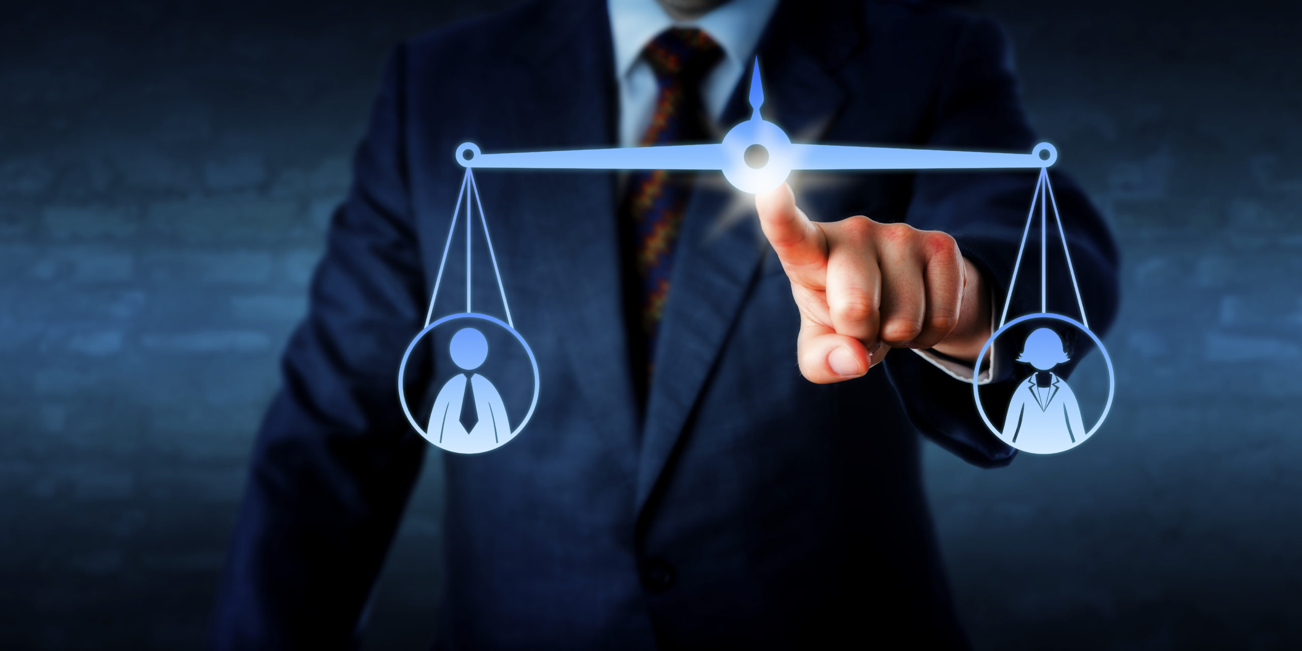 Manager Balancing Out A Female And A Male Worker