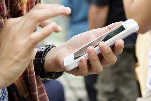 Teenage girl text messaging on her phone
