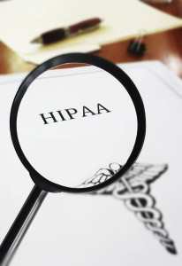 HIPAA healthcare document with magnifying glass