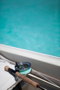 Still life of a fly rod in a boat