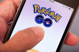 59371671 - tambov, russian federation - july 13, 2016 person hand starting pokemon go application on apple iphone5s. studio shot.