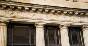 52496284 - national bank & trust engraved in stone facade with columns