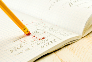 42249068 - pencil with eraser on exercise book background closeup