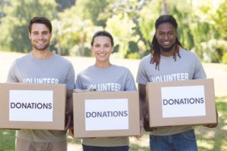 volunteers with donation