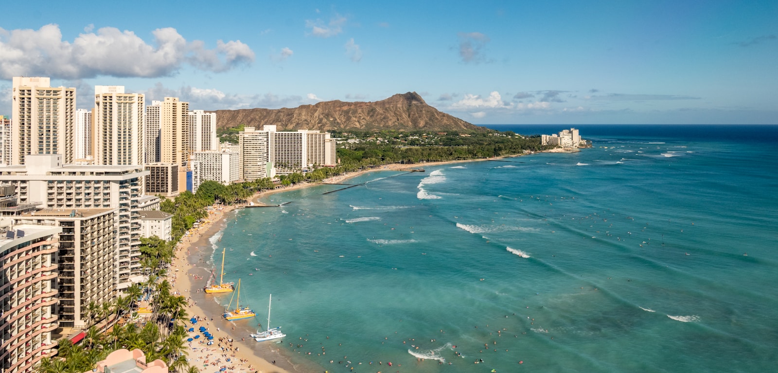 A memory of our 2017 vacation at Hawaii’s most popular beach - Waikiki. There’s only one like it, where the long sets of waves allow even the most inexperienced to hire a Malibu Longboard and give surfing a go. So much to enjoy in Waikiki, even with it’s popularity. Somehow people get absorbed into the many hotels, bars, shops, tours and, of course, the beach and Pacific Ocean. We hired a convertible Mustang to tour the island - great day out! (Photo taken from the Sheraton Hotel through glass)