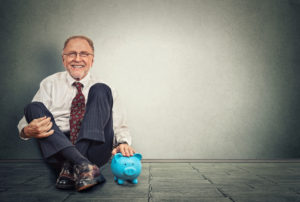 Happy man with piggy bank