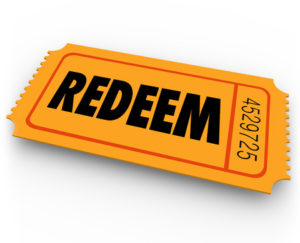 41726030 - redeem word on an orange ticket to illustrate special offer redemption or contest winning entry