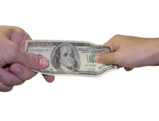 Two people fighting over money / business transaction / giving & taking money / shopping / divorce / power struggle / etc.