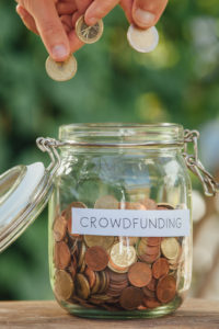 Crowdfunding money jar full of coins