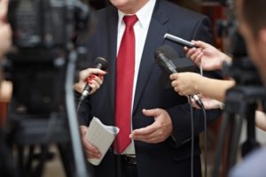 10320186 - close up of conference meeting microphones and businessman