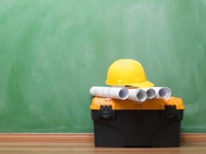 House improvement equipments and blueprints on blackboard