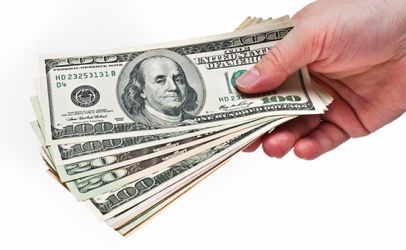 Hand with money isolated on the white background