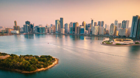 Emirate of Sharjah cityscape waterfront rising above Al Noor Island at city downtown in the UAE