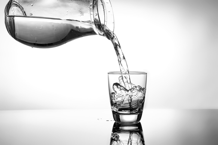 Filling in glass of water