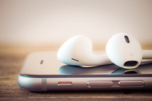 Closeup of earbuds and smartphone
