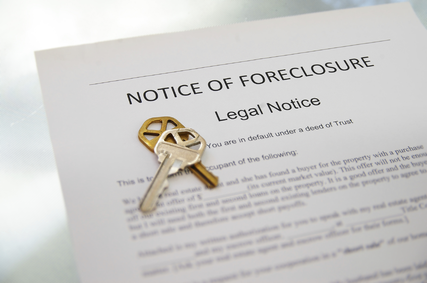 Notice of Foreclosure document and house key