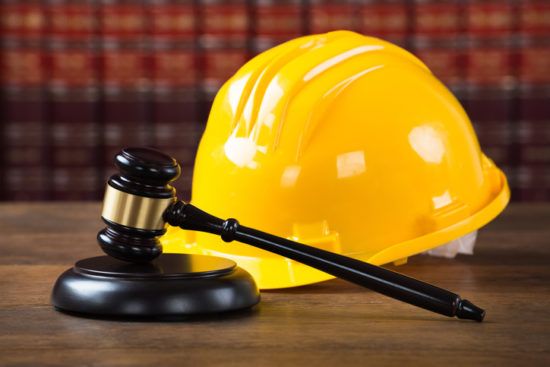 Mallet And Yellow Hardhat In Courtroom