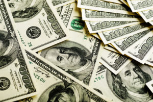 Cash in U.S. $100 bills, indicating litigation damages