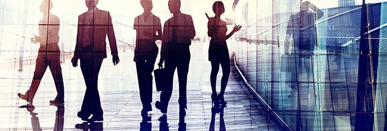 silhouettes-of-business-people-walking-in-the-office