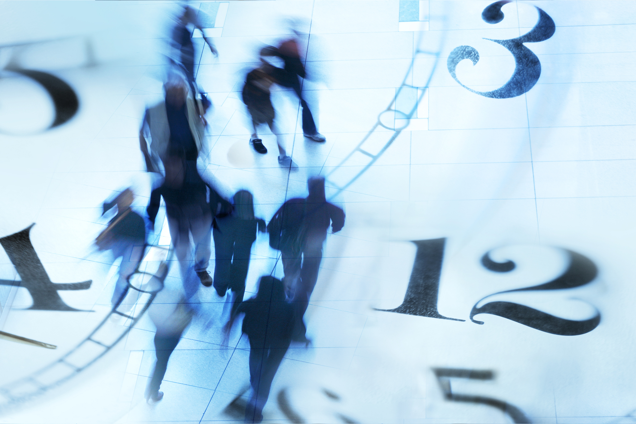 Montage Of Blurred Pedestrians Walking And Several Clock Faces