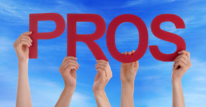people holding sign pros