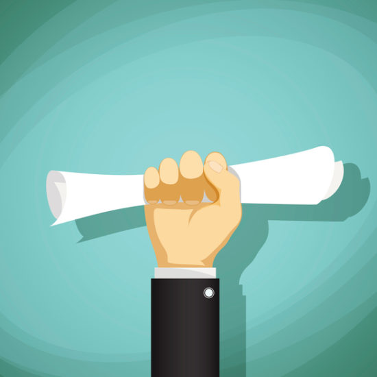 Human hand holding a document.
