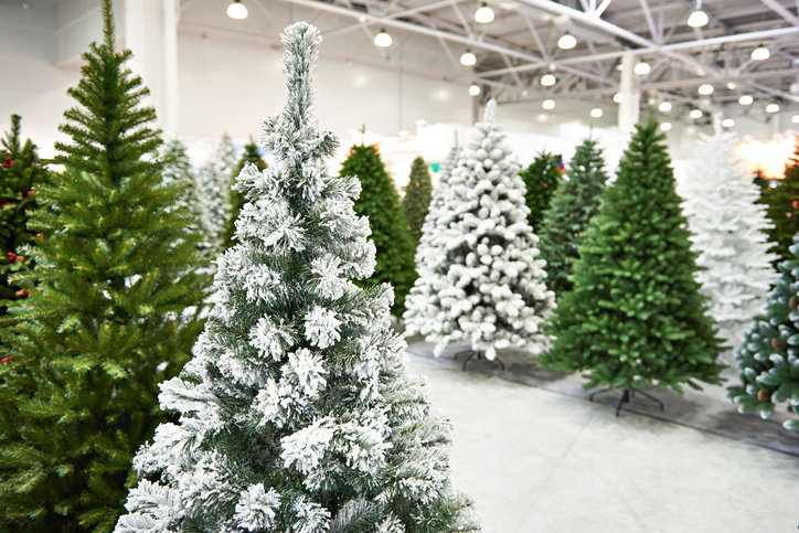 Decorative artificial christmas trees in store