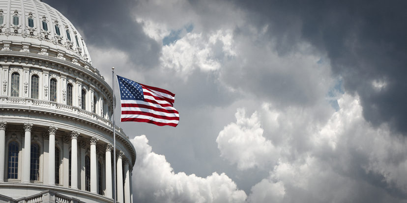 US Capitol and waving american flag