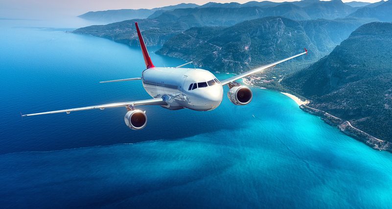 Airplane-Flying-Over-Island-e1552421500491.jpg