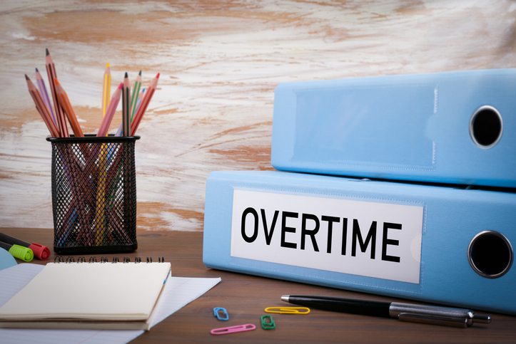 Overtime, Office Binder on Wooden Desk