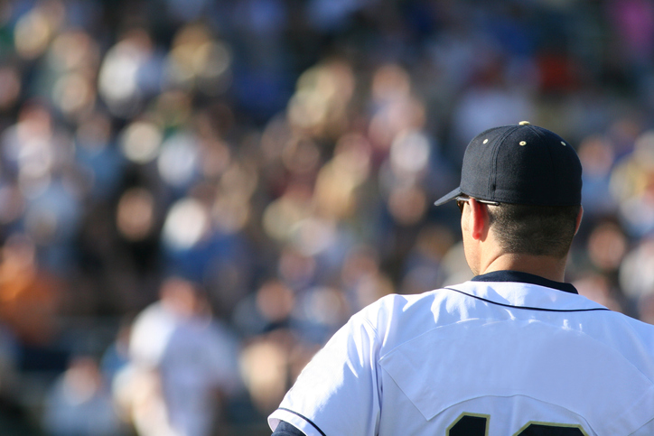 A picture of a baseball player and a white jersey