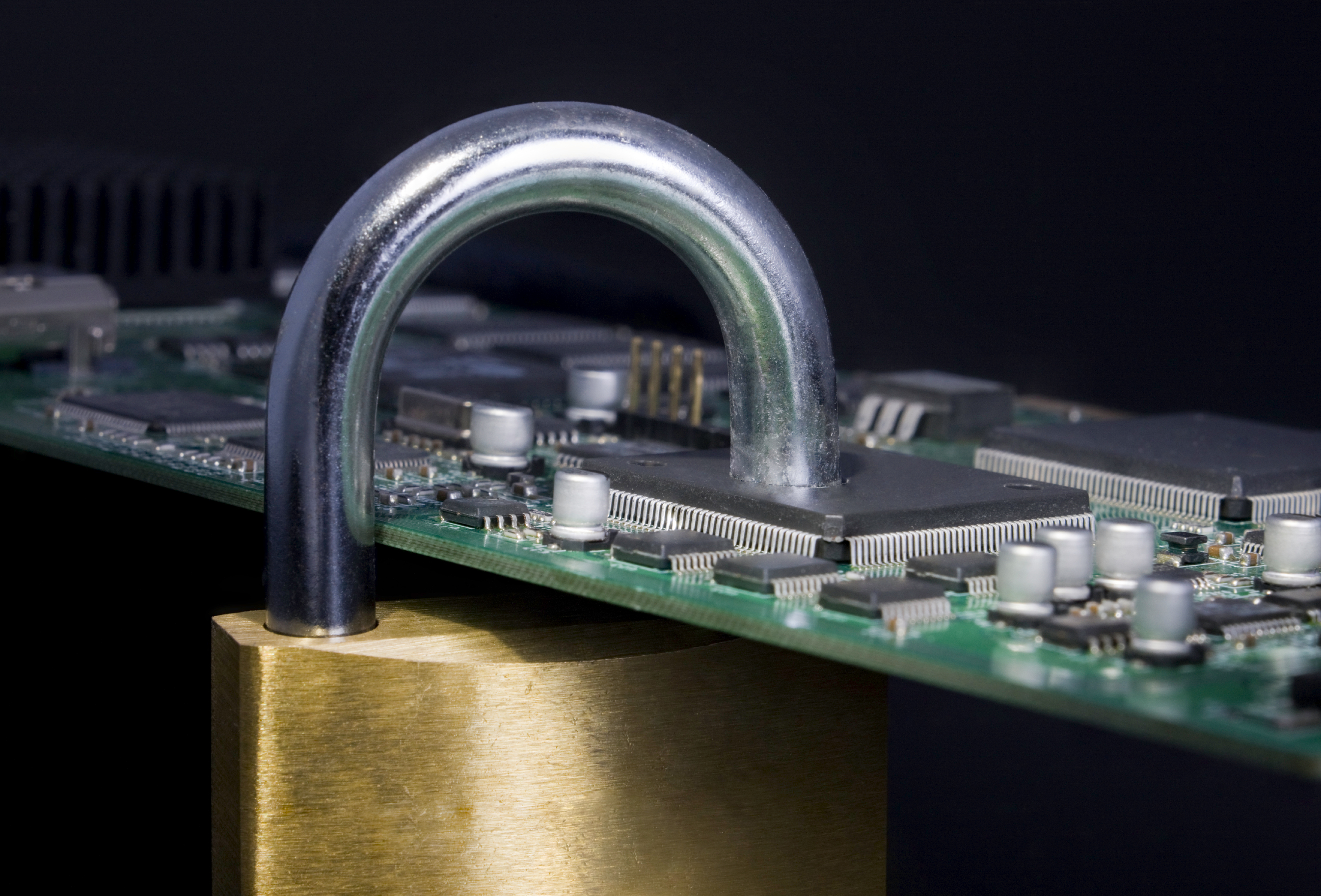Concept_Data Security_Padlock thru Chip_7169225Large