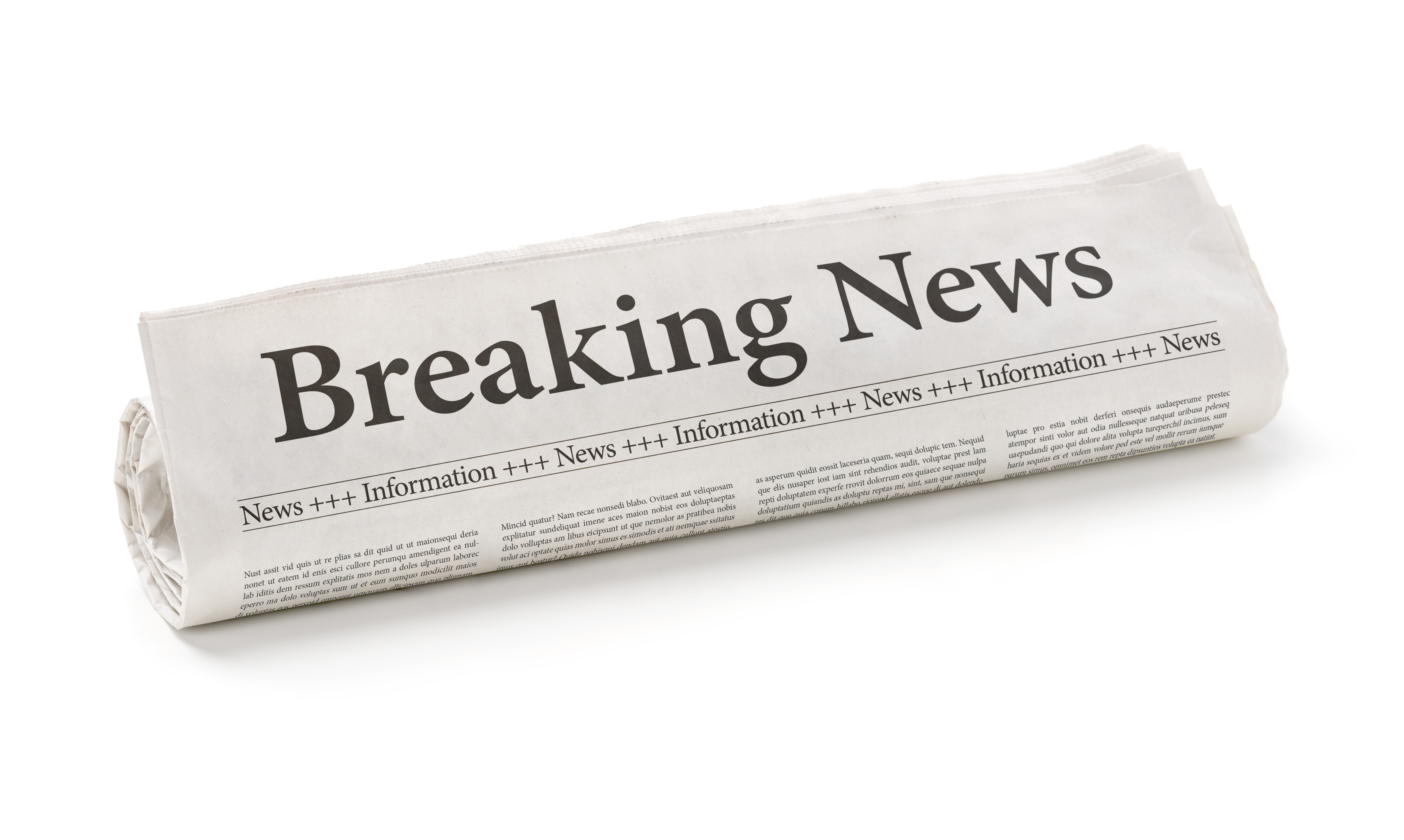 Rolled newspaper with the headline Breaking news