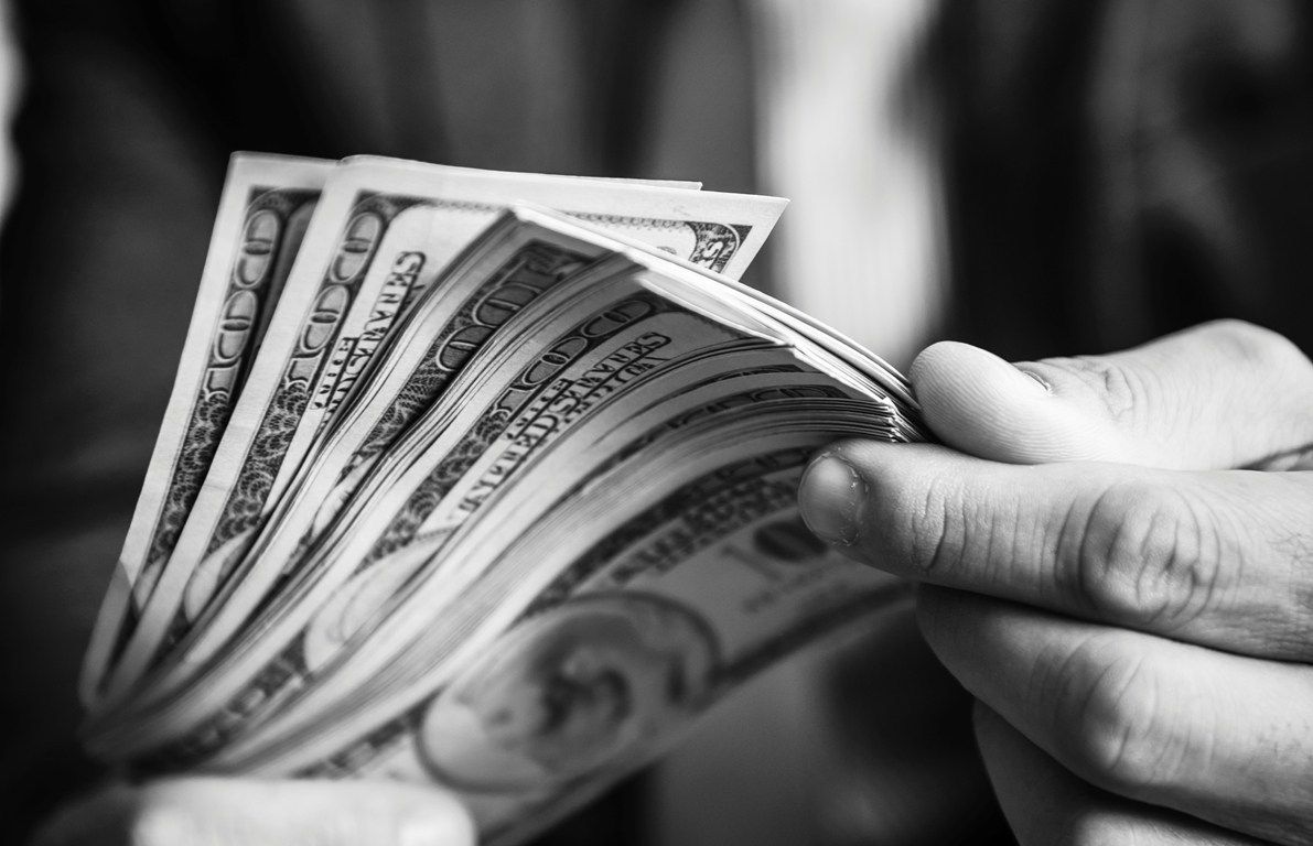 a-person-carrying-a-lot-of-cash-VP6EBQD.jpg