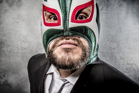 42329754 - angry businessman  with mexican wrestler mask