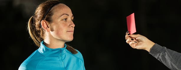 Athlete with red card