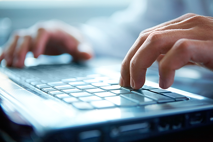 Labor and employment_man typing on computer
