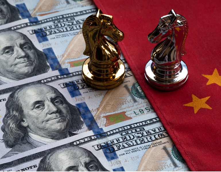 chess-game-battle-of-chess-on-chinese-flag-and-us-dollar-bank-note-picture-id1146503527
