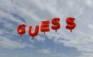 Red balloons on blue sky spelling "Guess"