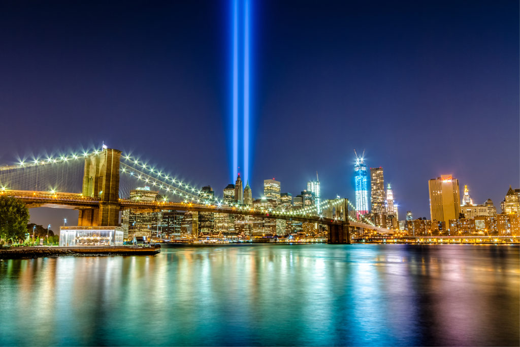 New York City skyline with two lights shining where Twin Towers once stood.