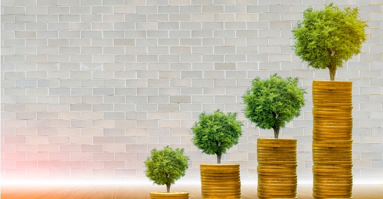trees-with-money-saving-money-and-growing-hands-picture-id1174448128