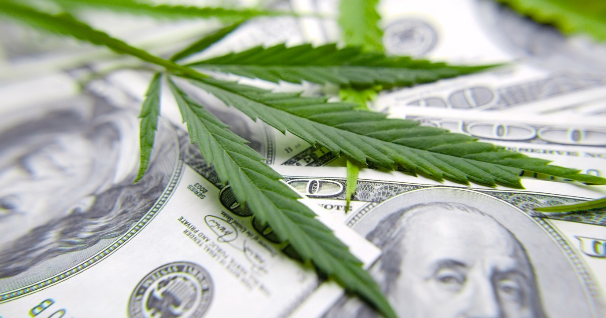 cannabis-leaf-on-dollar-bill-green-leaf-of-marijuana-money-and-hemp-picture-id1143359897