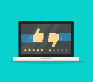 Feedback online or review on computer laptop concept vector illustration, flat cartoon pc with voting hands thumbs gesture and reviews stars, idea of like or dislike symbols