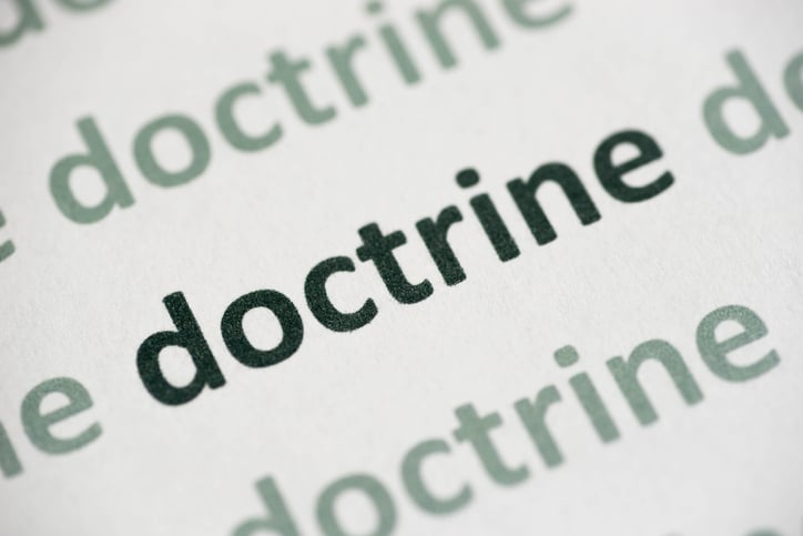 word doctrine printed on paper macro