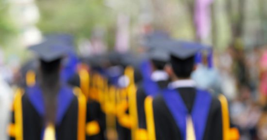 blurry-of-graduates-are-walking-the-line-get-a-diploma-picture-id622008374